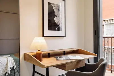 a kitchen with white cabinets and a dishwasher at Falco - 2 bedrooms with shared pool in Les Corts in Barcelona