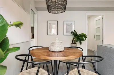 a living room with a couch and a table at Falco - 2 bedrooms with shared pool in Les Corts in Barcelona