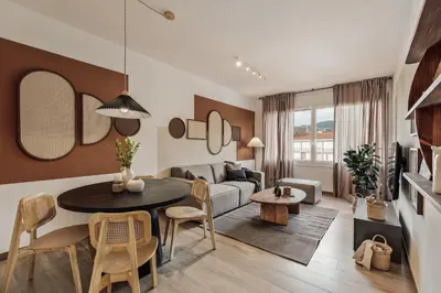 a living room with a table and a couch at Gumus - 3 bedrooms and office in Les Tres Torres in Barcelona