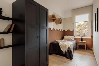 a living room with a couch and a table at Gumus - 3 bedrooms and office in Les Tres Torres in Barcelona
