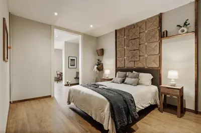 a living room with a couch and a table at Yaxha - 4 bedrooms and terrace in Eixample Dreta in Barcelona