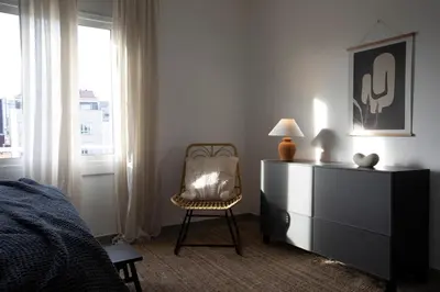 a living room with a blue couch and a table at Yoko - 3 bedrooms and terrace in Eixample Dreta in Barcelona