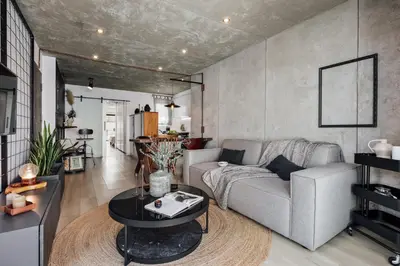 a living room with a couch and a table at Aoraki - Penthouse and terraces in Eixample Dreta in Barcelona