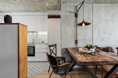 a living room with a couch and a tv at Aoraki - Penthouse and terraces in Eixample Dreta in Barcelona