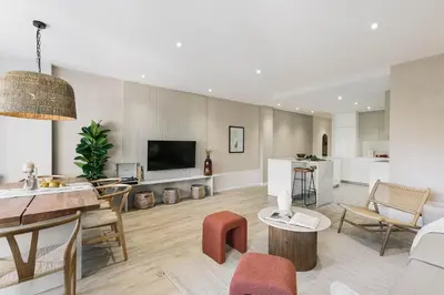 a living room with a couch and a table at Arienzo - 2 bedrooms and balcony in Sant Gervasi in Barcelona