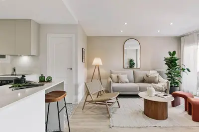 a kitchen with white cabinets and a dining room at Arienzo - 2 bedrooms and balcony in Sant Gervasi in Barcelona