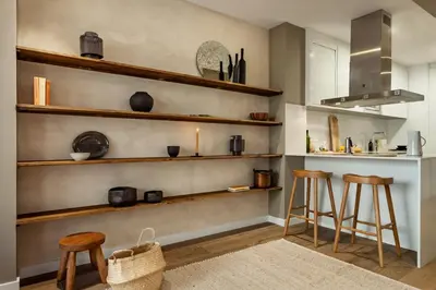 a bedroom with two beds and a mirror at Chalby - 4 bedrooms in Eixample Esquerra in Barcelona