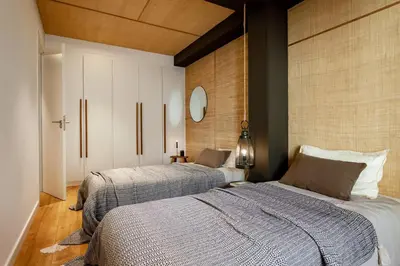 a bedroom with a large bed in a white room at Chalby - 4 bedrooms in Eixample Esquerra in Barcelona
