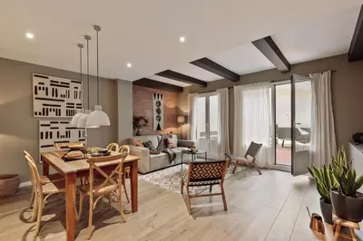 a living room with a couch and a table at Chalby - 4 bedrooms in Eixample Esquerra in Barcelona