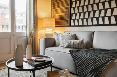 a bedroom with a large bed with two lamps at Amourah - 2 bedrooms in Eixample Esquerra in Barcelona