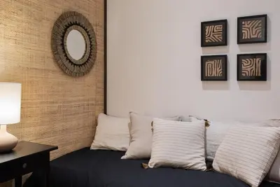a bedroom with a large bed and a large window at Amourah - 2 bedrooms in Eixample Esquerra in Barcelona