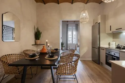 a living room with a couch and a table at Amourah - 2 bedrooms in Eixample Esquerra in Barcelona