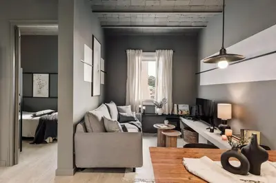 a room with a bedroom with a bed and a window at Pirineu - 2 bedrooms in Sant Gervasi in Barcelona