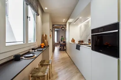 a home office with a desk in a hallway at Nubian - 2 bedrooms in Eixample Dreta in Barcelona