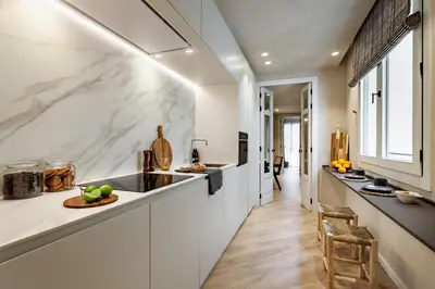 a bedroom with a bed with pillows on it at Nubian - 2 bedrooms in Eixample Dreta in Barcelona