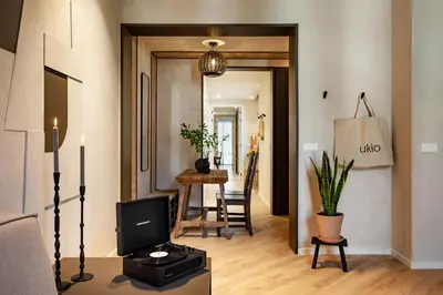 a kitchen with a long counter and a sink at Nubian - 2 bedrooms in Eixample Dreta in Barcelona