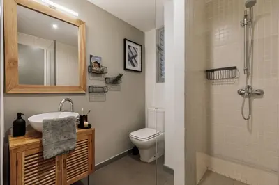 a bedroom with a large white bed and a black wall at Basil - 3 bedrooms and terrace in Sant Gervasi in Barcelona