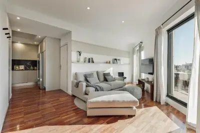 a bedroom with white cabinets and a bed at Fluvia - 2 bedrooms and terrace in Sant Gervasi in Barcelona