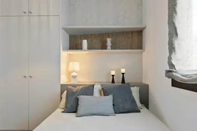 a bedroom with a large bed and a large window at Fluvia - 2 bedrooms and terrace in Sant Gervasi in Barcelona