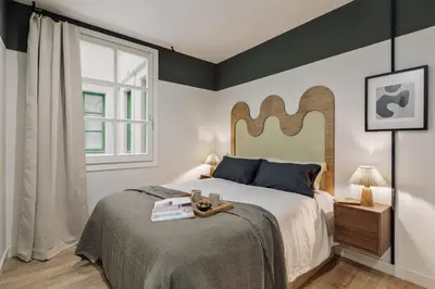 a living room with a couch and a table at Mescit - 2 bedrooms and balcony in Eixample Dreta in Barcelona