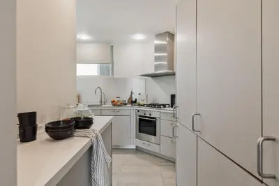 a living room with a tv on a wall at Misir - 2 bedrooms and terrace in Eixample Dreta in Barcelona