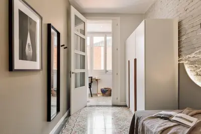 a living room with a couch and a table with oranges on it at Salar - 2 bedrooms in Gràcia in Barcelona