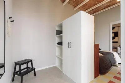 a bathroom with a sink and a bed at Pacaya - 2 bedrooms, office and balcony in Eixample Dreta in Barcelona