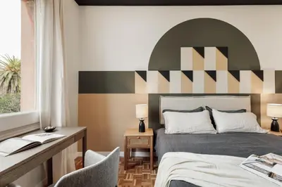 a living room with a mirror and a table at Adile - 4 bedrooms and balcony in El Putxet in Barcelona