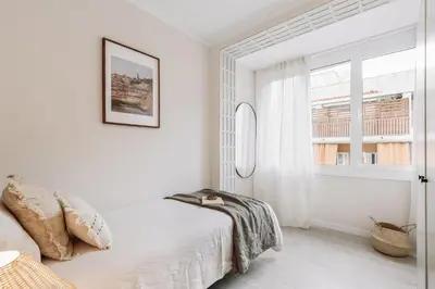 a living room with a couch and a tv at Stabia - 2 bedrooms in Sant Gervasi in Barcelona