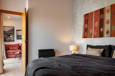 a kitchen and dining room with a table and chairs at Hassi - 2 bedrooms and terrace in Gràcia in Barcelona