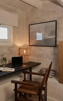 a living room with a couch and a clock on the wall at Kalahari - 2 bedrooms and terrace in Gràcia in Barcelona