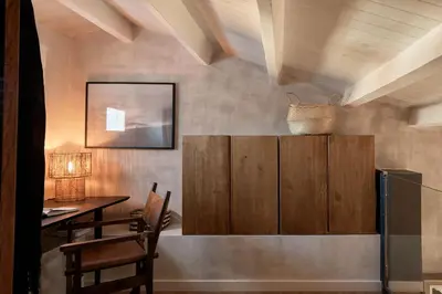 a bedroom with a black bed and a couch at Kalahari - 2 bedrooms and terrace in Gràcia in Barcelona