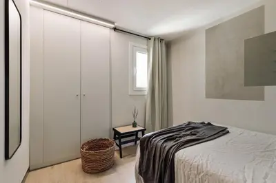 a dining room with a table and a mirror at Coipasa - 3 bedrooms and terrace in Eixample Dreta in Barcelona