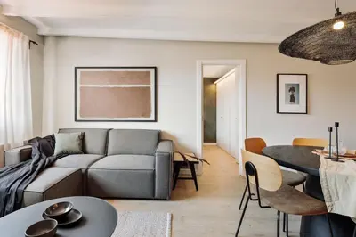 a bedroom with a large bed with a table on it at Coipasa - 3 bedrooms and terrace in Eixample Dreta in Barcelona