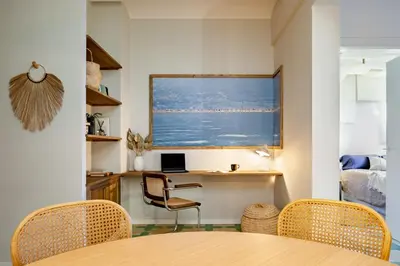 a kitchen with white cabinets and a sink at Lidi - 2 bedrooms and balcony in Eixample Esquerra in Barcelona