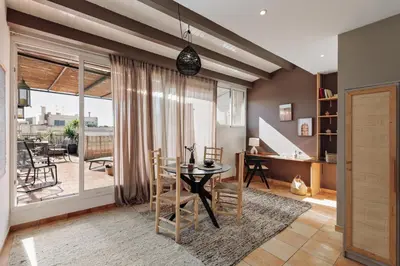 a living room with a couch and a table at Finnt - 1 bedroom and terrace in Eixample Dreta in Barcelona