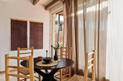 a living room with a couch and a table at Finnt - 1 bedroom and terrace in Eixample Dreta in Barcelona