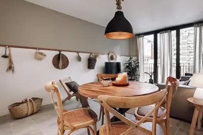 a living room with a couch and a table at Pinar - 2 bedrooms and office in Eixample Esquerra in Barcelona
