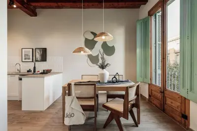 a living room with a couch and a table at Chixoy - 3 bedrooms and balcony in Eixample Dreta in Barcelona