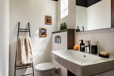 a bathroom with a sink and a toilet and a tub at Hegra - 2 bedrooms, balcony in Eixample Esquerra in Barcelona