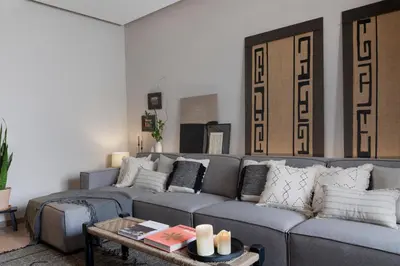 a living room with a couch and a table at Bara - 2 bedrooms in Eixample Dreta in Barcelona