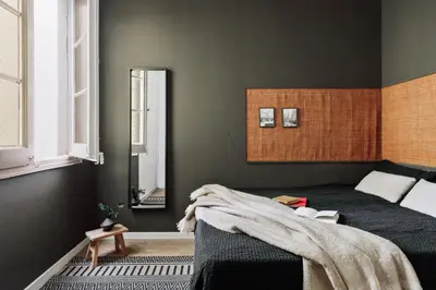 a bed with two lamps and two books on it at Anefis - 3 bedrooms and office in Gràcia in Barcelona