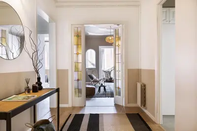 a bedroom with a bed and a mirror at Anefis - 3 bedrooms and office in Gràcia in Barcelona
