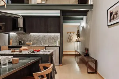 a kitchen with a table and a bike on the wall at Thar - 1 bedroom in Ciutat Vella in Barcelona