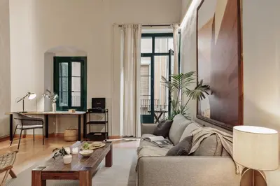 a bedroom with a bed and a wooden wall at Thar - 1 bedroom in Ciutat Vella in Barcelona