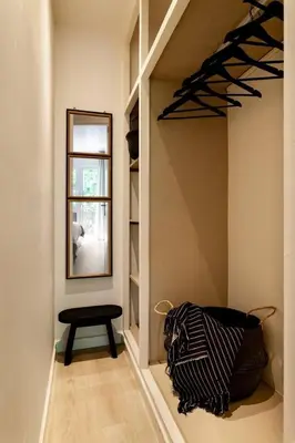 a patio with two chairs and a table on a brick wall at Rissani - 2 bedrooms in Sant Gervasi in Barcelona