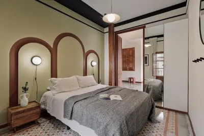 a living room with a bed and a couch at Marmara - 3 bedrooms and terrace in Sant Pere in Barcelona
