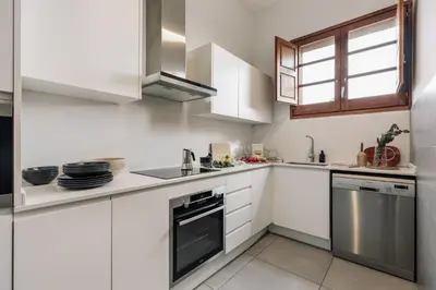a bedroom with a bed with a dog laying on it at Marmara - 3 bedrooms and terrace in Sant Pere in Barcelona