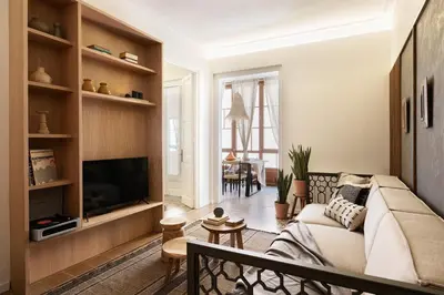 a bedroom with a king sized bed and a couch at Erfoud - 3 bedrooms in Gràcia in Barcelona