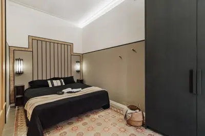 a bathroom with a sink and a mirror at Erfoud - 3 bedrooms in Gràcia in Barcelona